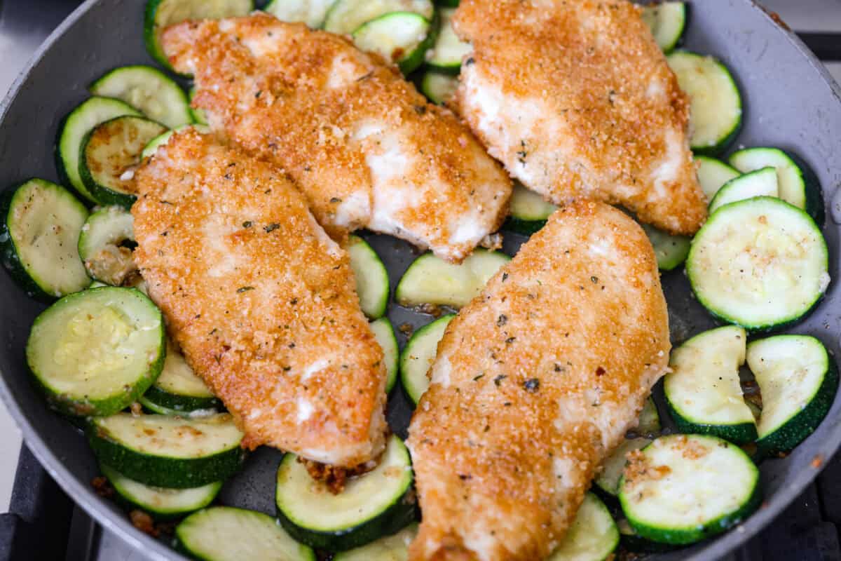 My family and I cannot get enough of this versatile summer vegetable! Whether you use it for a side dish or the entrée, its tender texture and ability to absorb flavor is unmatched. Take advantage of zucchini being in season and try out some of my other favorite zucchini recipes! Cooked chicken added back to the skillet.