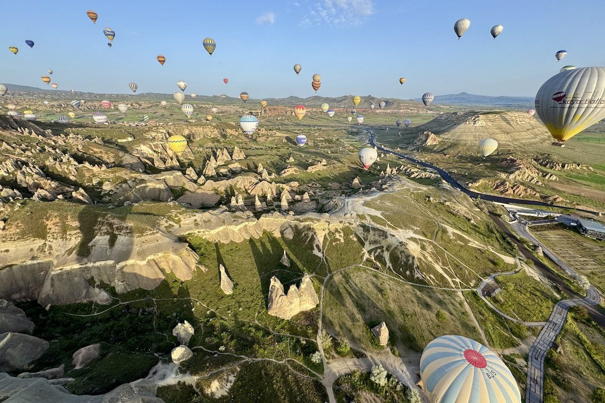 Hot air balloons fly over Göreme