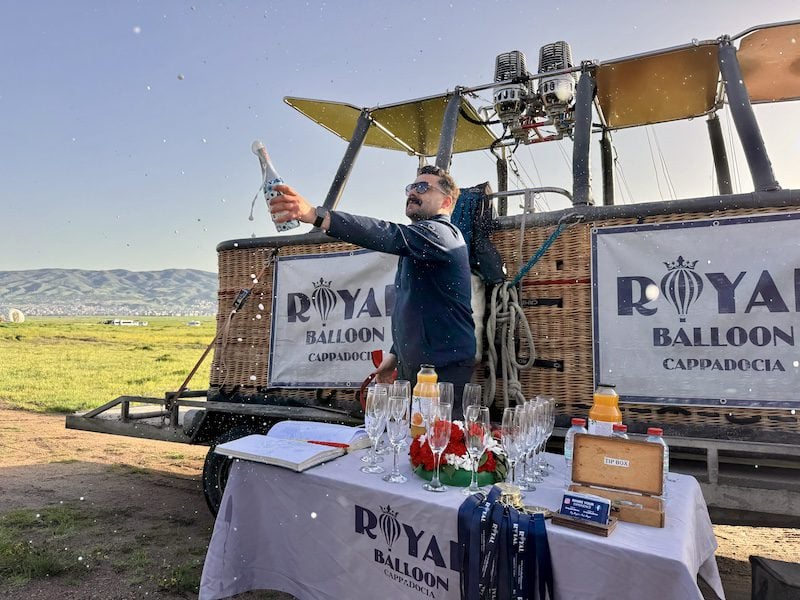 Royal Balloon Pilot Ümit Ertosun celebrates after the flight