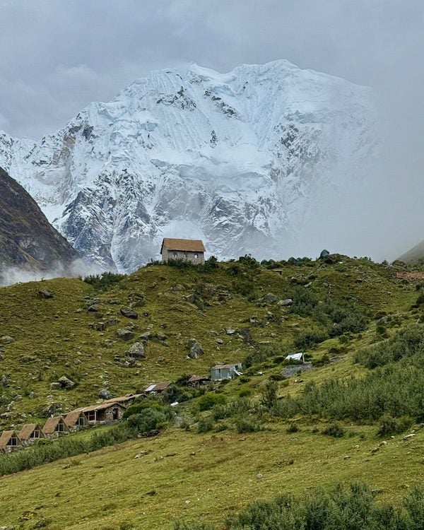 Salkantay Mountain looks high above the foothills in the Peruvian Andes