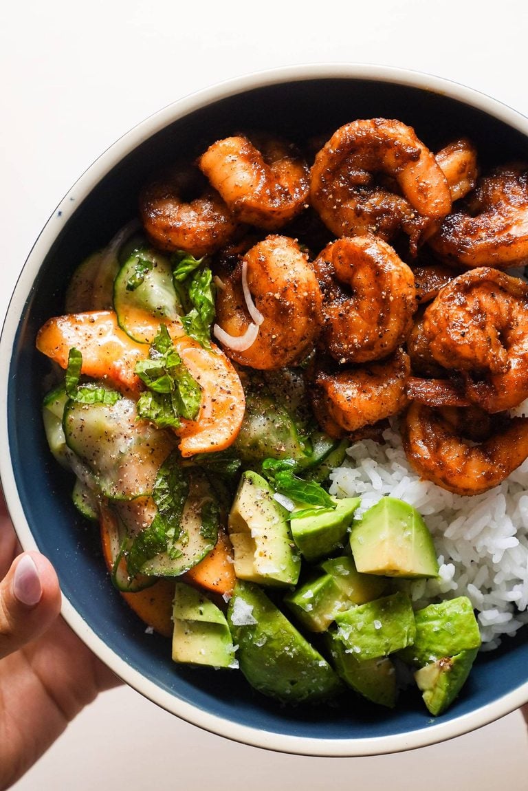 Spicy shrimp with peach salad and rice.