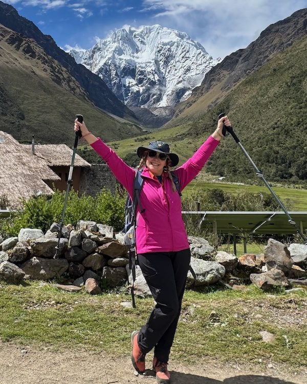 The writer enjoying a moment of flat trail, with an eye to the pass in the background