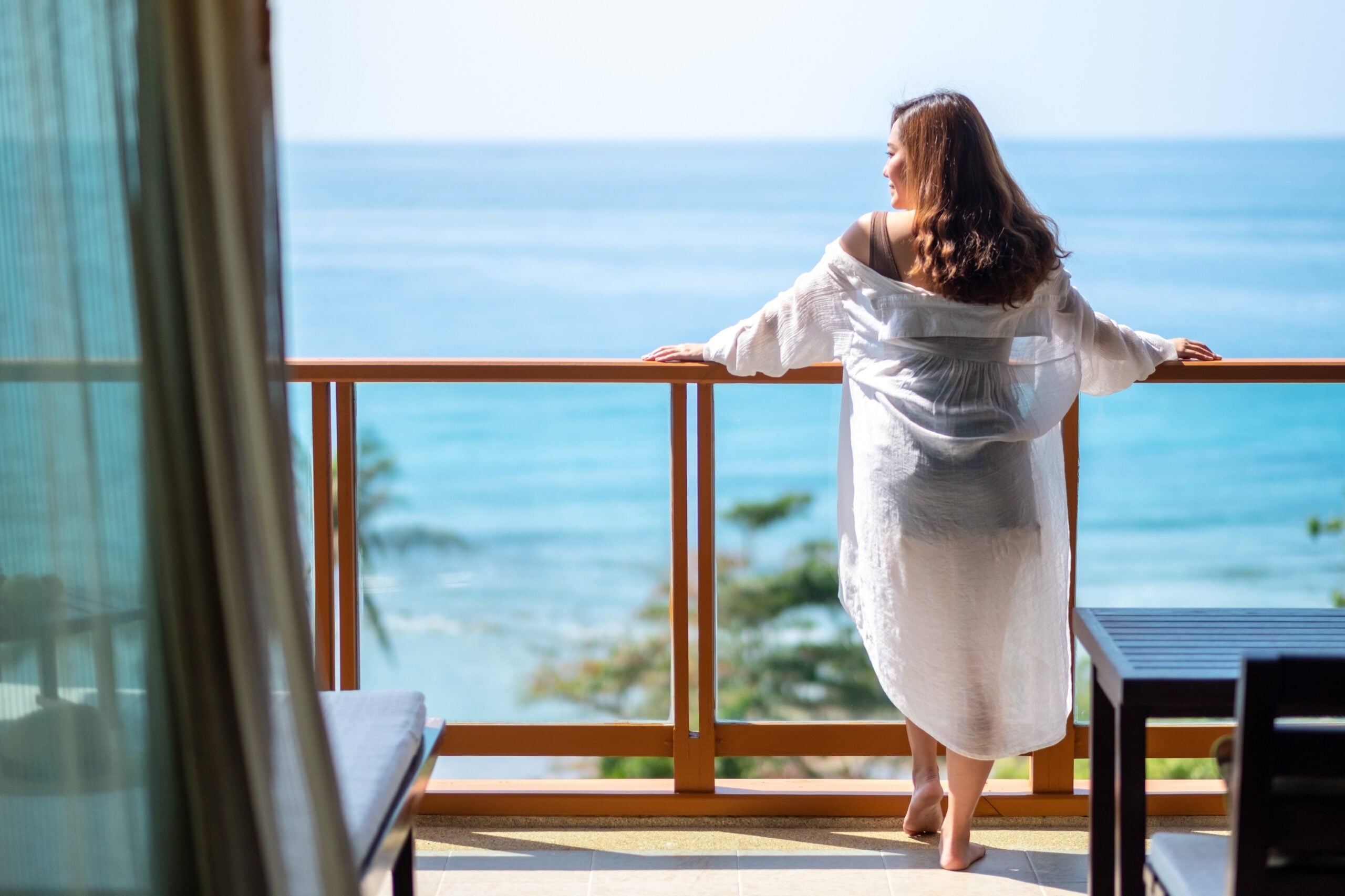 asian woman on a hotel balcony