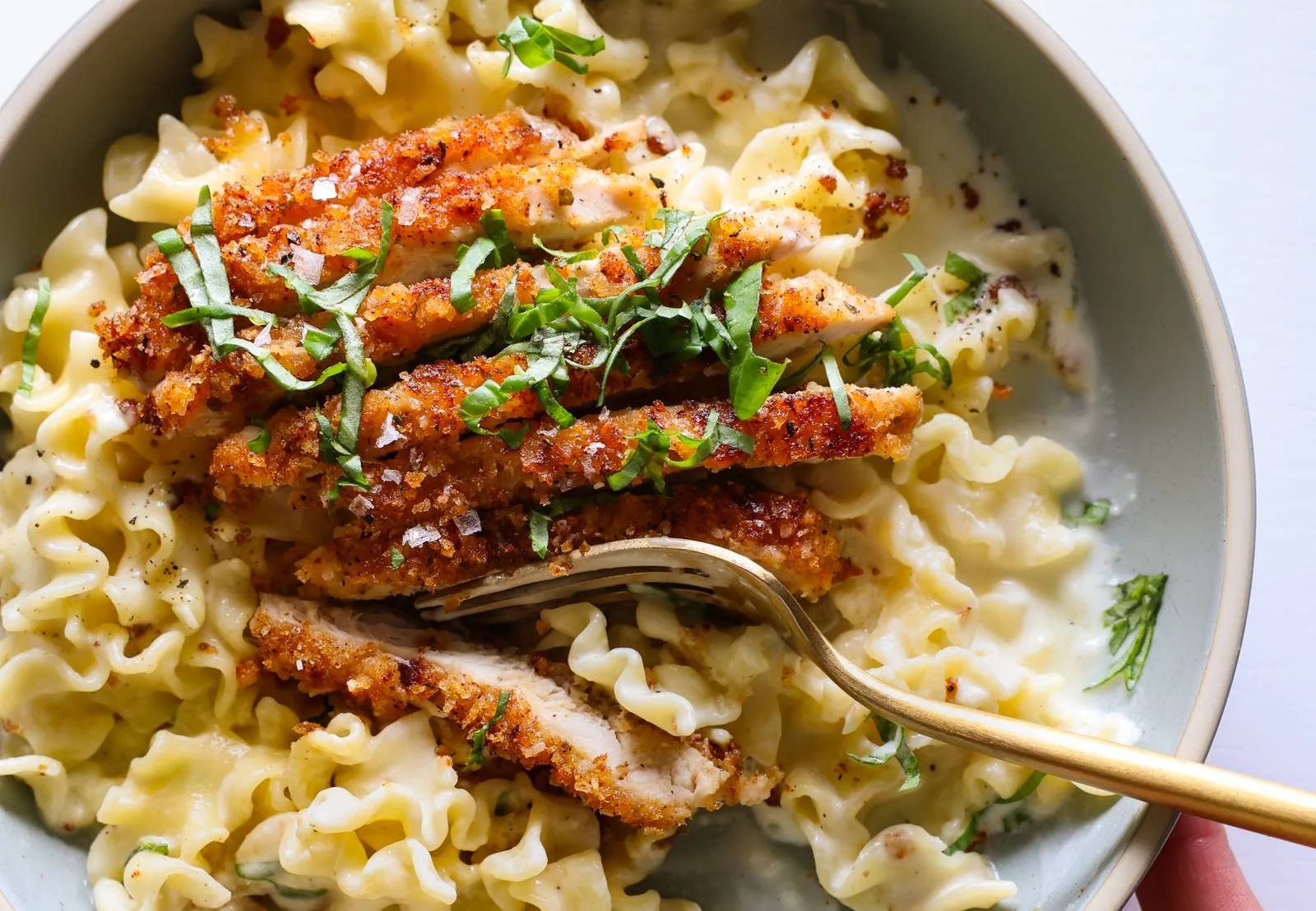 Crispy chicken on creamy lemon pasta.