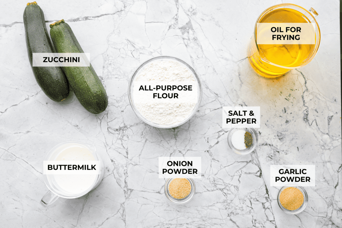 Overhead shot of labeled ingredients for crispy zucchini strings. 