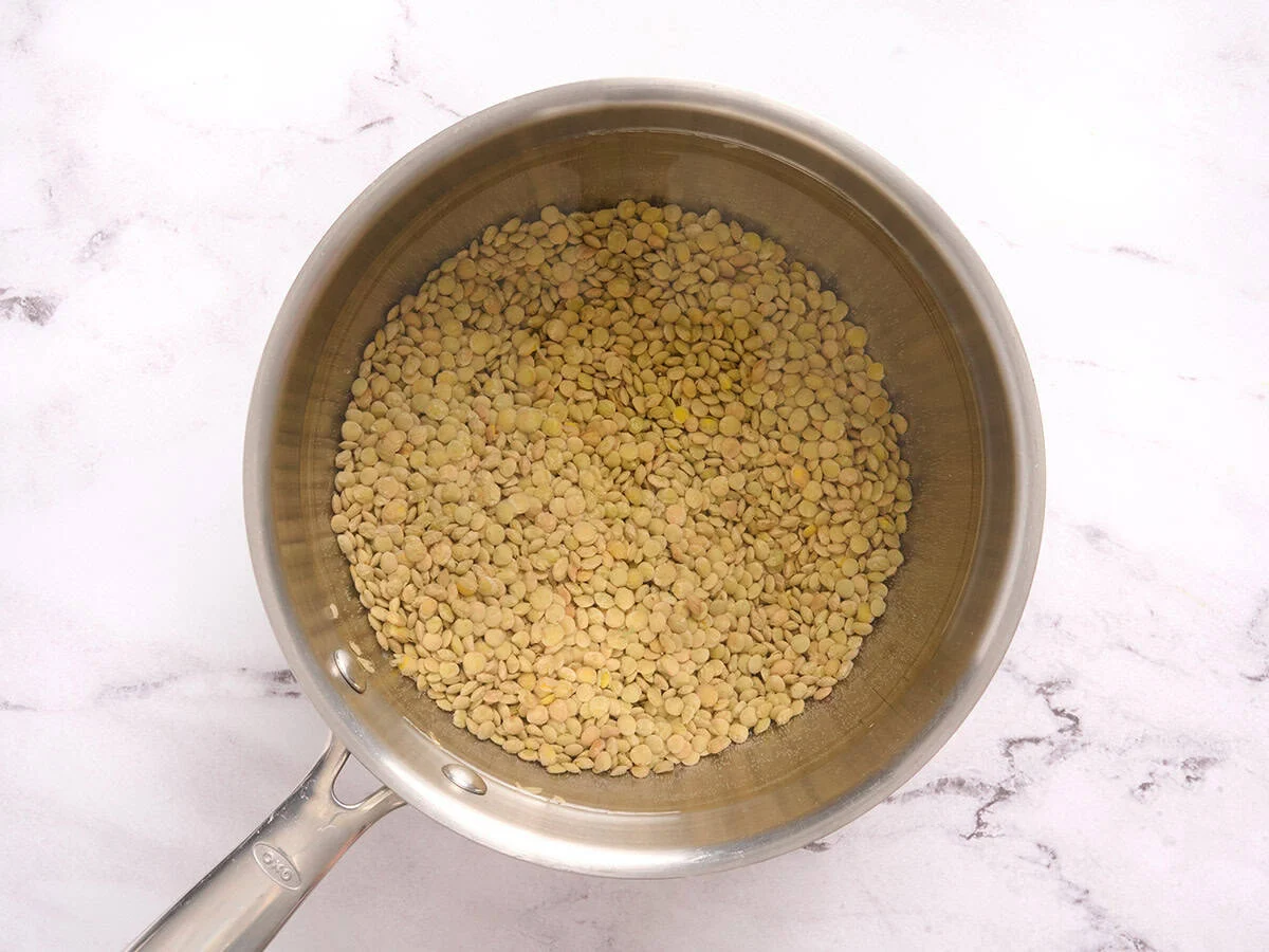 Lentils cooking in a saucepan.