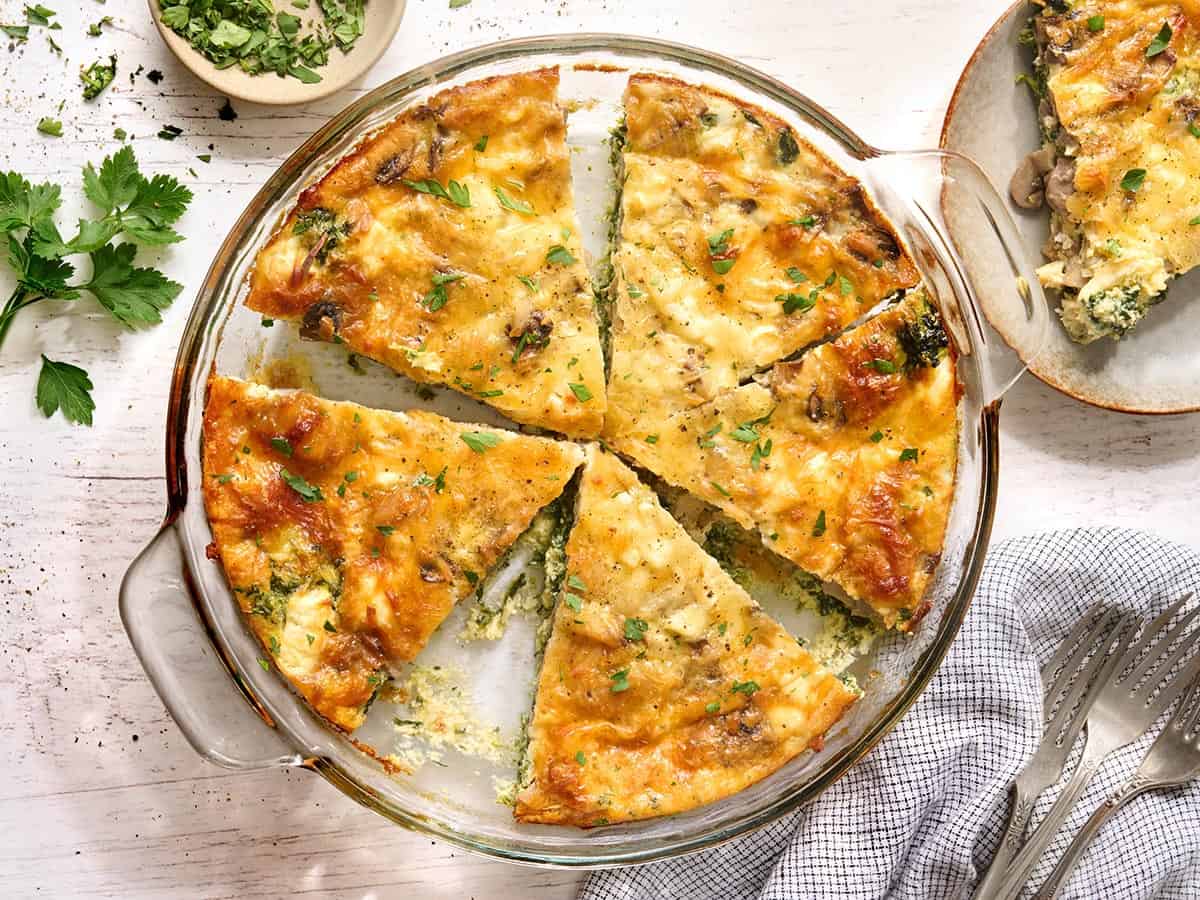 Overhead view of slices of crustless quiche in a dish.