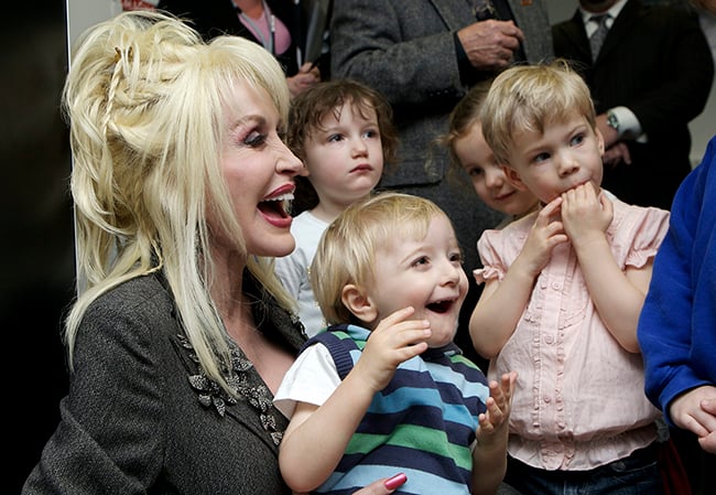 Dolly Parton with young children at an Imagination Library event