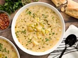 Overhead view of a bowl of potato corn chowder.