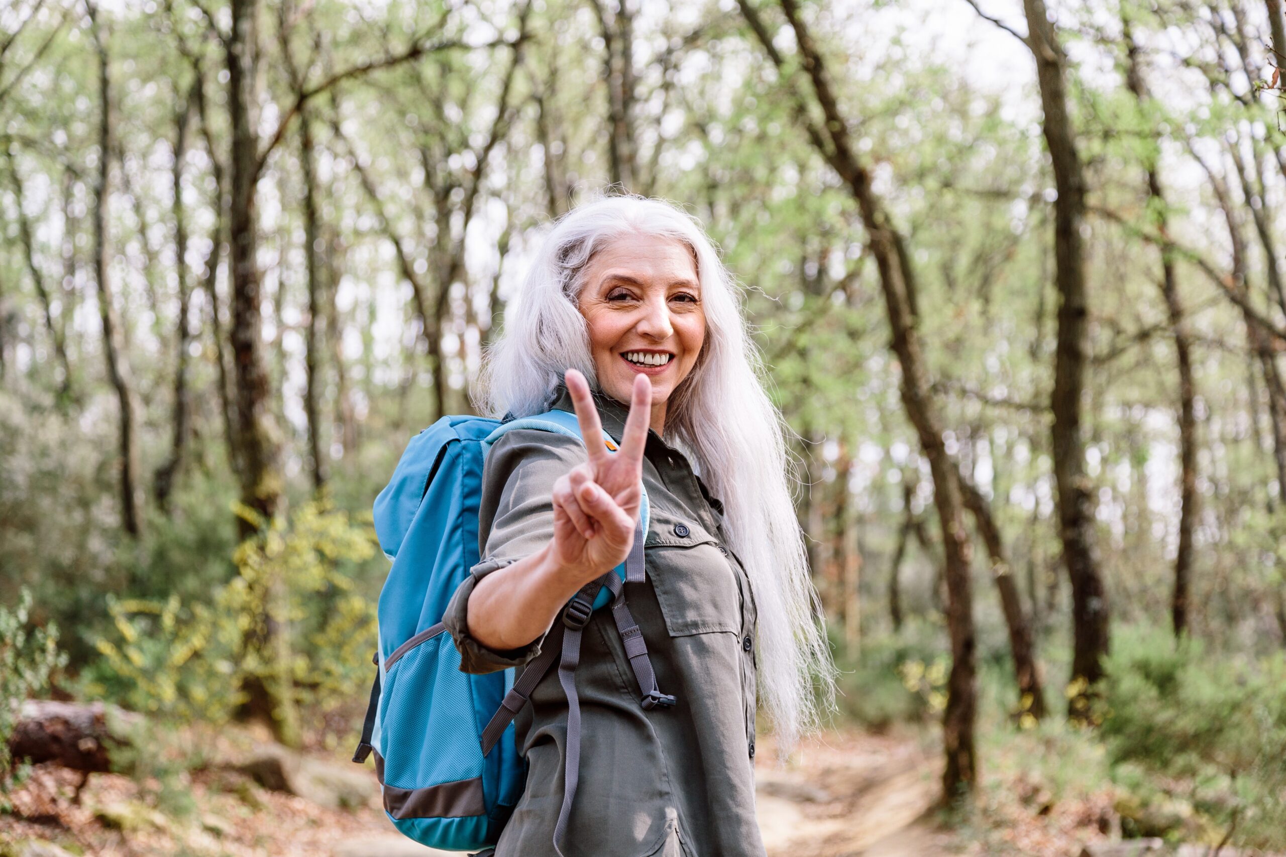 older woman backpacking with b corp company