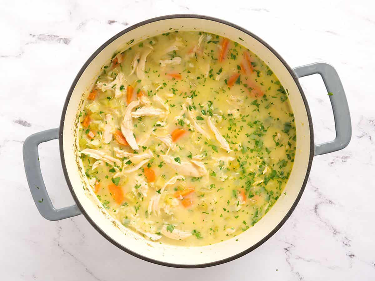 Overhead view of a pot of Greek chicken soup.