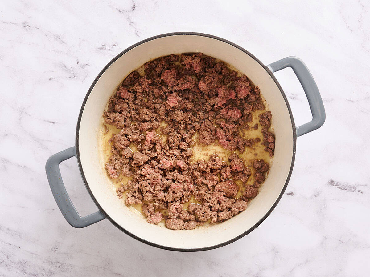 Browned ground beef in a sauce pan.