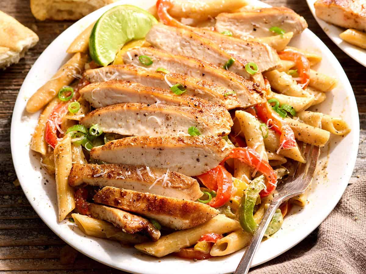 Overhead side view of rasta pasta on a plate.