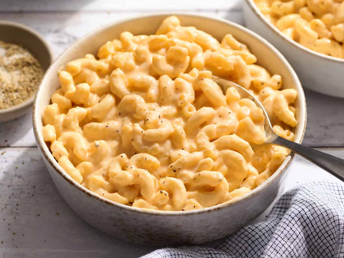 Side view of crockpot mac and cheese in a bowl.