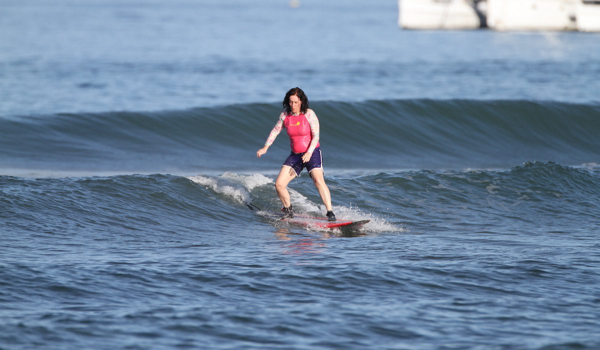 Ariel Frager surfing with Las Olas Surfing for Women camp