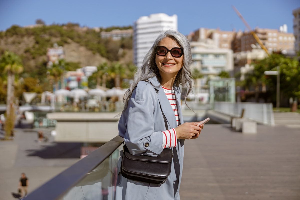 An older woman expresses her personal style and still dress for safer travel while on the road