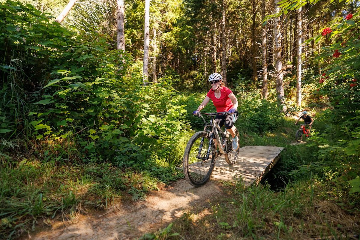 Ariel Frager mountain biking with a female outdoor guide