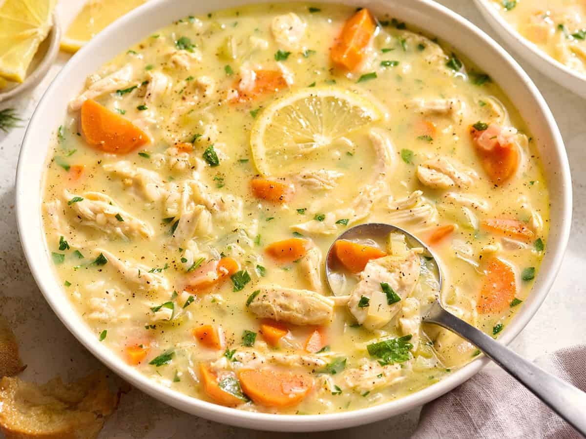 Overhead front view of Greek chicken soup in a bowl.