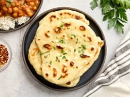homemade naan from overhead on a plate