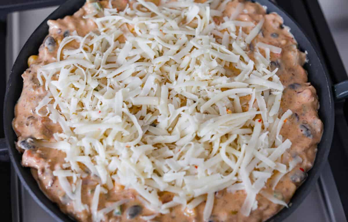 Cheese added to the top of all of the melted and combined ingredients. 