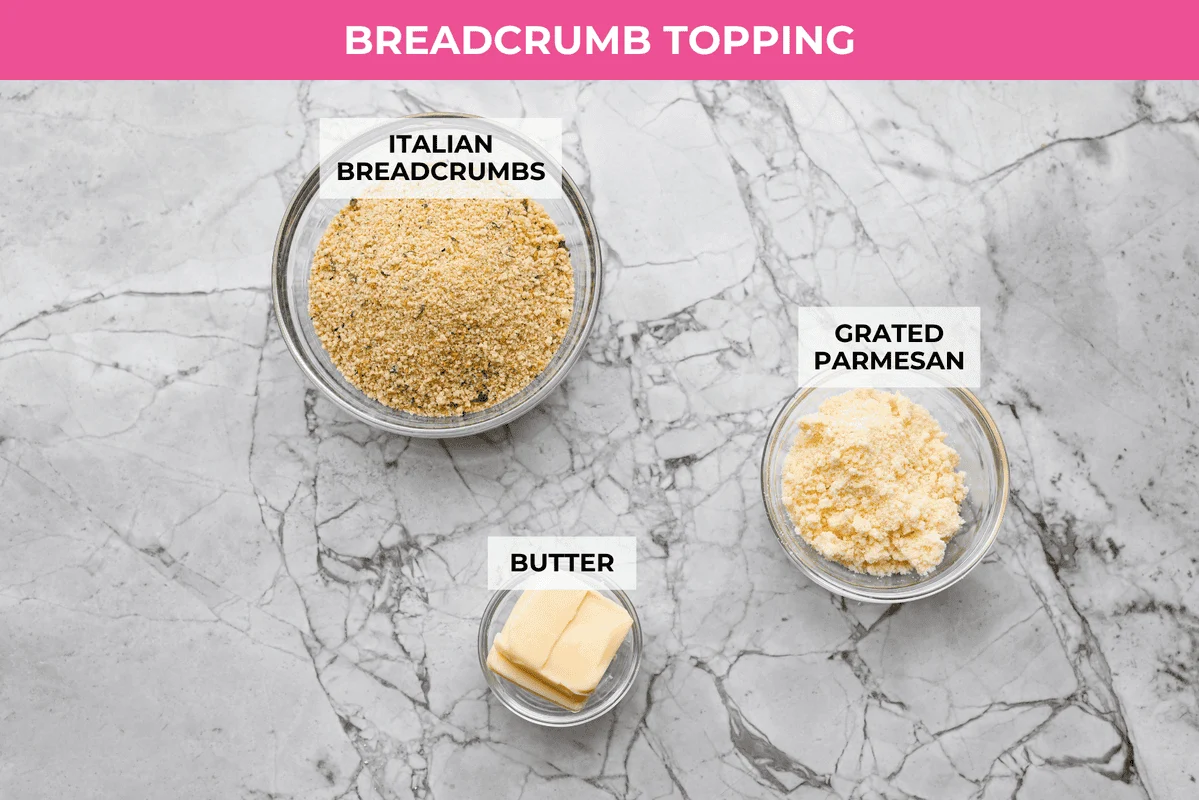 Craving chicken parm? Grab a spoon! This chicken parmesan soup is loaded with tender chicken, pasta, and a rich, creamy tomato broth. Finish with crispy, buttery breadcrumbs for a delicious twist on the Italian classic! Overhead shot of labeled breadcrumb topping ingredients.