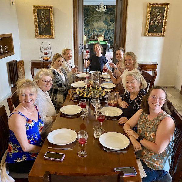 A group of women enjoying a meal on a sober retreat