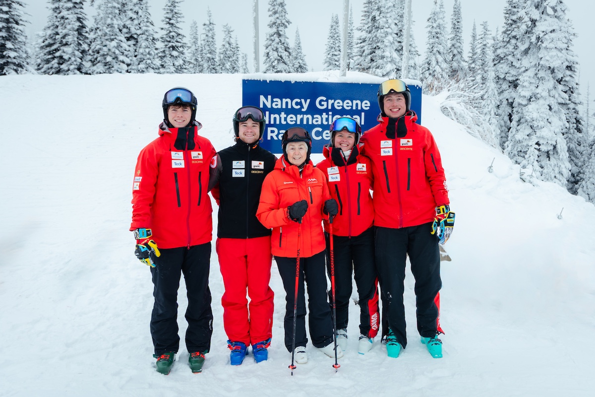 Nancy Greene in front of the sign for her training area in Sun Peaks, British Colombia