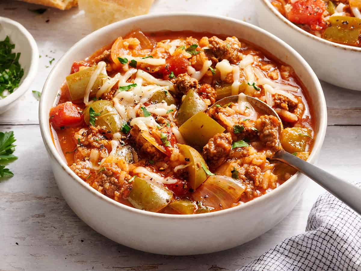 Side view of a bowl of Overhead view of a pot of stuffed pepper soup.