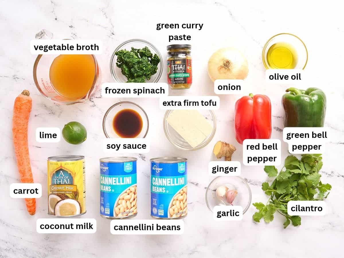 The ingredients for coconut curry beans and greens with labels.