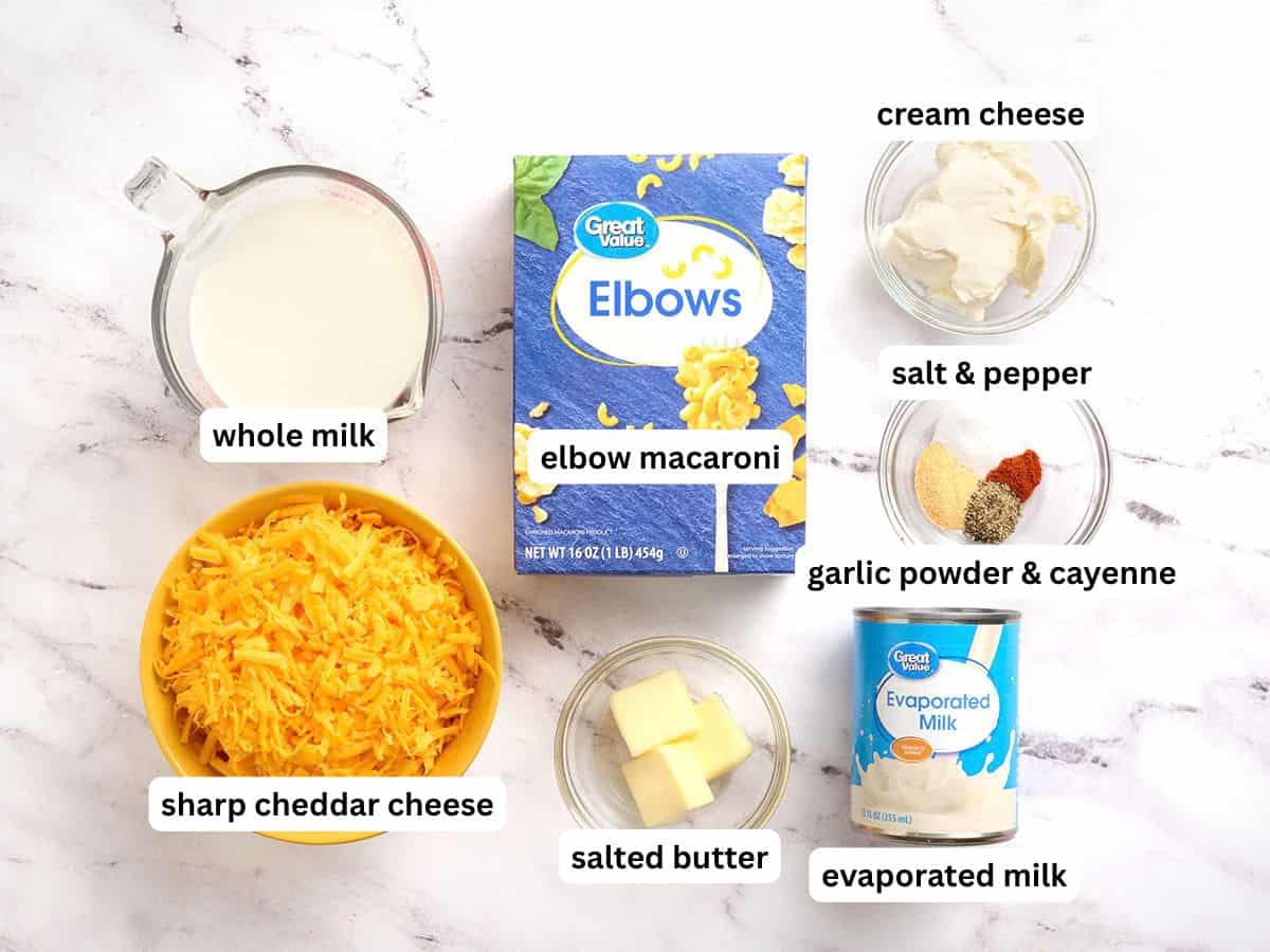 The ingredients to make crockpot mac and cheese with labels.